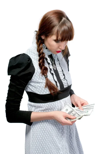Uma jovem com dinheiro nas mãos. Em um fundo branco . — Fotografia de Stock