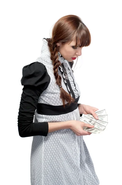 A young girl with money in their hands. On a white background. — Stock Photo, Image