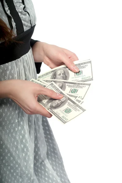 Une jeune fille avec de l'argent dans les mains. Sur fond blanc . — Photo