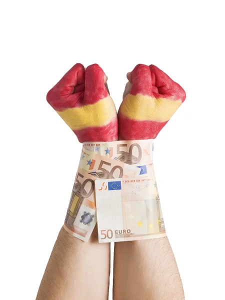 Två händer målade flagga Spanien och handbojor med 50 euro räkningar — Stockfoto