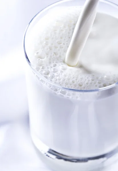 Stock image Pouring milk into the glass