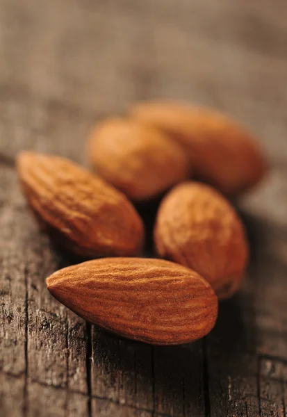 Almonds on the wooden table — Stock Photo, Image