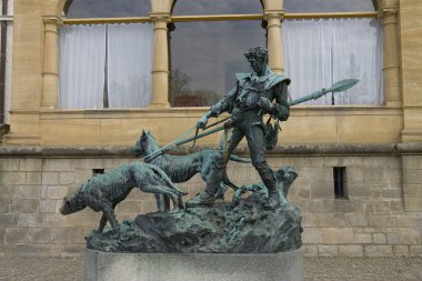 Statue of hunter with dogs clipart