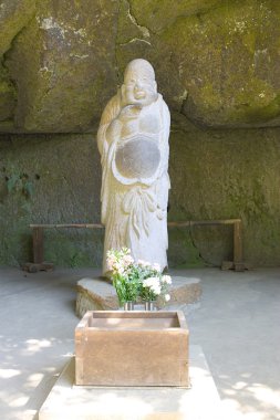 Statue of god Hotei clipart
