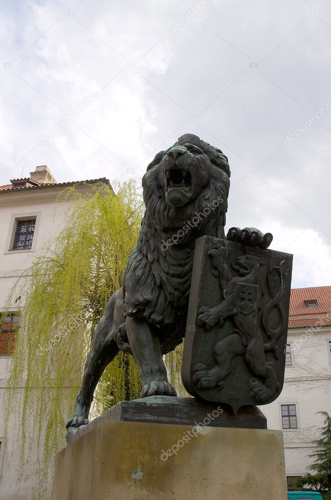Statue of lion with coat of arms of Czech Republic