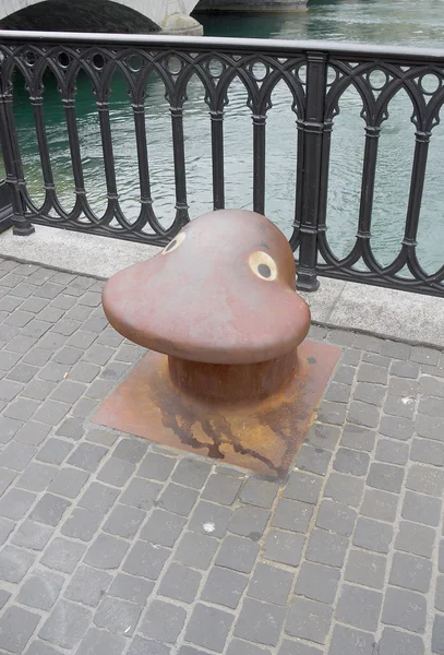 Old bollard with funny eyes — Stock Photo, Image