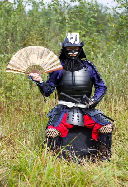 stock image Samurai in armor with fan