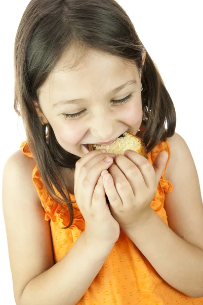 Dziewczynka jedzenie kawałek ciasta — Zdjęcie stockowe