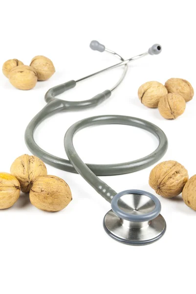 Stetoskop a vlašské ořechy — Stock fotografie