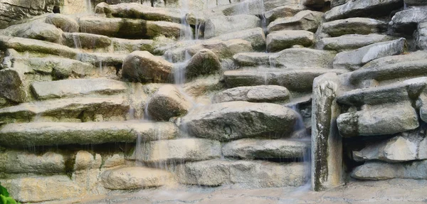 stock image Stone wall and the flowing water