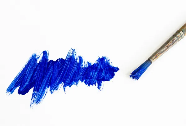 Brush and blue painting — Stock Photo, Image