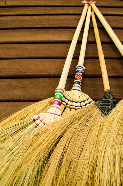 Stock image Broom on wooden wall