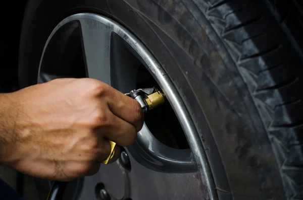 stock image Refilling air into a car tyre