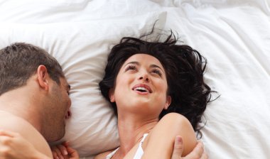 Smiling attractive woman having fun with a man clipart
