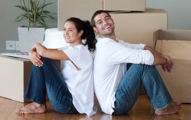 Delighted couple moving house clipart