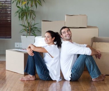 Glowing couple sitting on the floor clipart