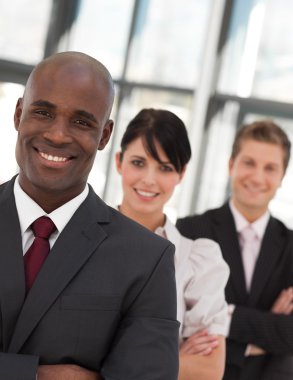 Portrait of a business team looking at the camera clipart