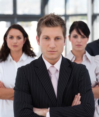 Portrait of a professional business team looking at the camera clipart