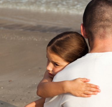 Portrait of a cute Daughter Hugging his father clipart