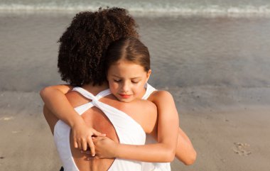 Ortrait of a relaxed Daughter Hugging her mother clipart