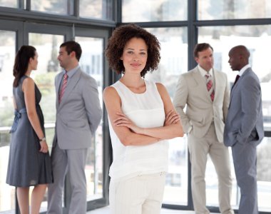 Beautiful Afro-american Businesswoman arms folded with his colle clipart