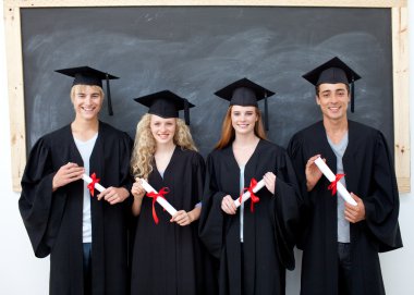 Group of adolescents celebrating after Graduation clipart