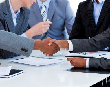 Close-up of business greeting each other clipart