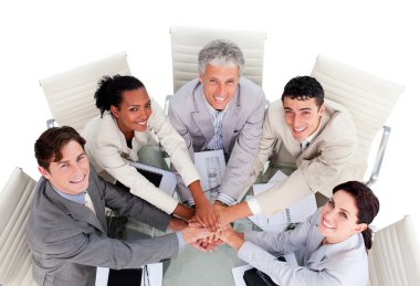 Cheerful multi-ethnic business team in a meeting clipart