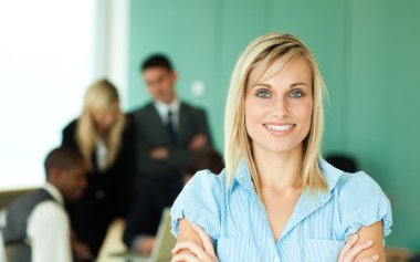 Businesswoman in front of working in an office clipart