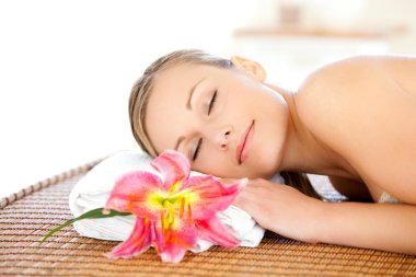 Portrait of a cute woman having a massage clipart