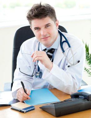 Self-assured doctor talking with a female patient clipart