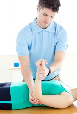 Handsome man doing fitness exercises with a woman clipart