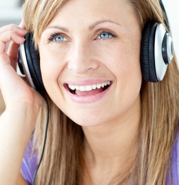 Laughing woman listening to music clipart