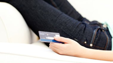 Close-up of a woman holding a card clipart