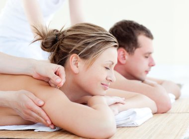 Loving couple having an acupunctre therapy clipart