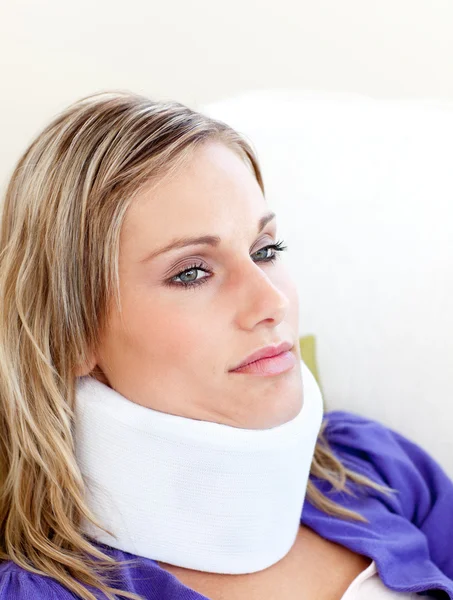 Unhappy woman with a neck brace — Stock Photo, Image