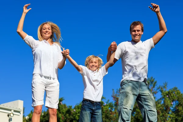 Cheerful caucasian Family Playing in the garden — Stock Photo, Image