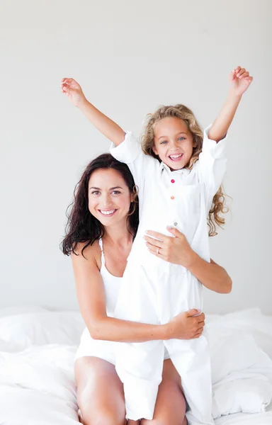 Attentive mother hugging her daughter — Stock Photo, Image