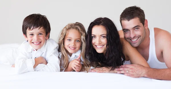 Happy family lying together — Stock Photo, Image