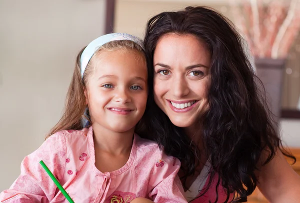Brunette mother with blond daughter — Stock Photo, Image