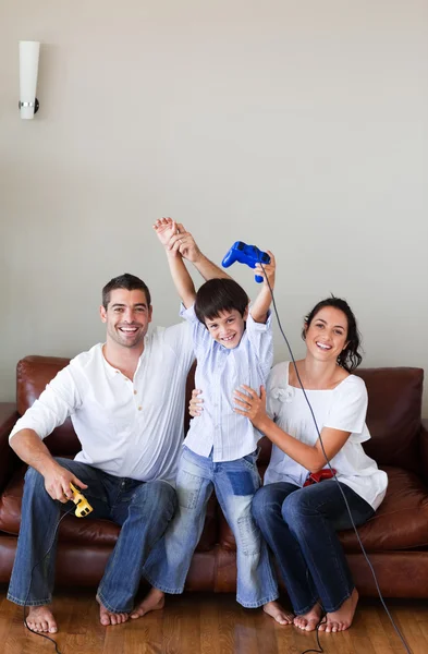 Cute boy plays with his parents video games — Stock Photo, Image