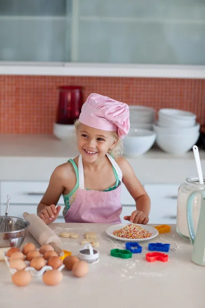 Beautiful young girl working in the kitchen — Stock Photo, Image