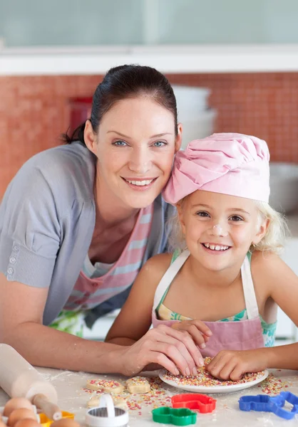 Happy mother and daughter in the kitchen — Stock Photo, Image