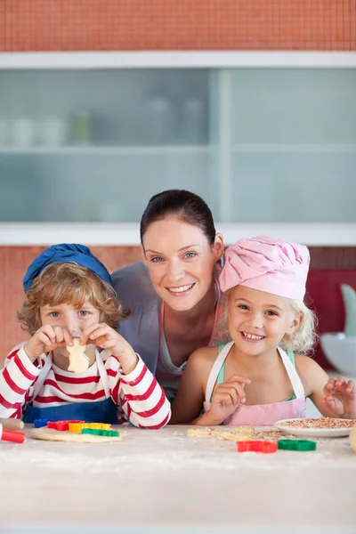 Enamoured mother with her two children — Stock Photo, Image