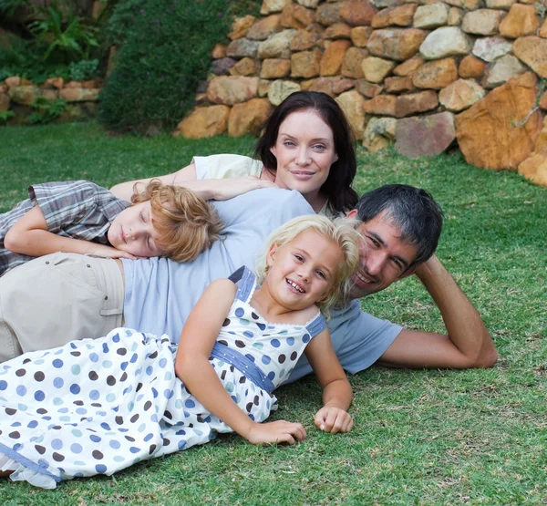 Happy family in the garden — Stock Photo, Image