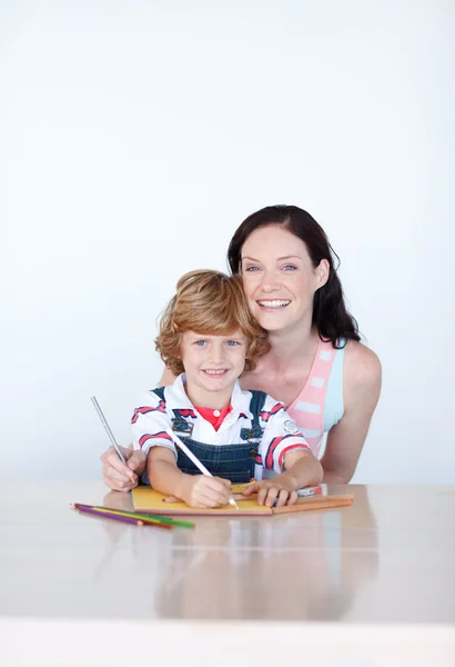Bright mother and son smiling to the camera — Stock Photo, Image