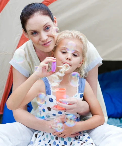 Handsome mother with he daughter and air blowing — Stock Photo, Image