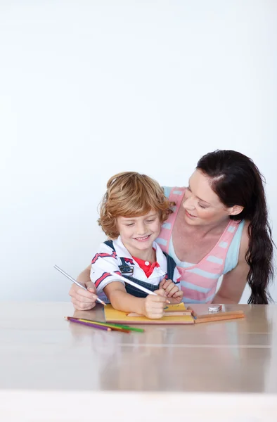 Loving mother help his son to draw a picture — Stock Photo, Image