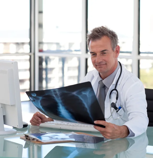 Handsome senior doctor with x-ray — Stock Photo, Image