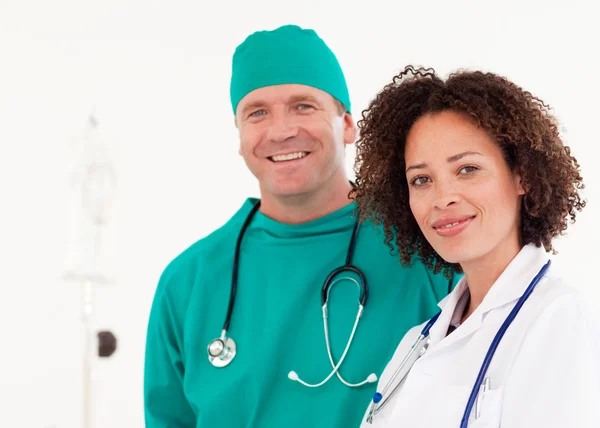 Portrait of a glowing doctor with surgeon in green scrubs — Stock Photo, Image